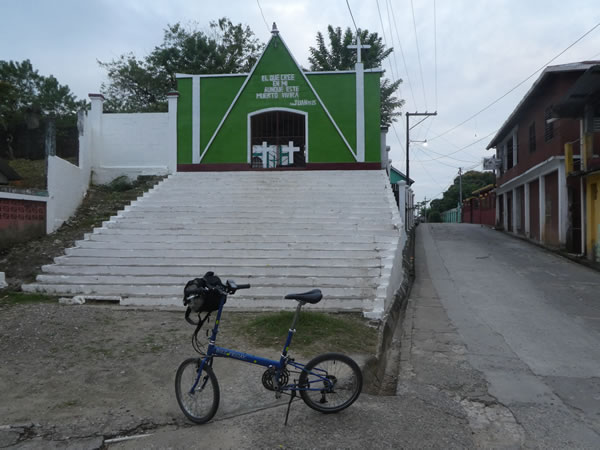 Ted’s bike in front of entrance to cemetery in Livingston, Guatemala.
