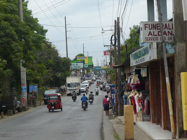 The main street (highway GA13) in the town of Rio Dulce, Guatemala.