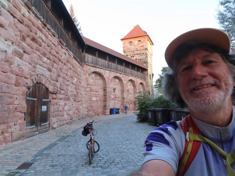 Ted with his bike by wall around Nuremberg near Imperial Castle.