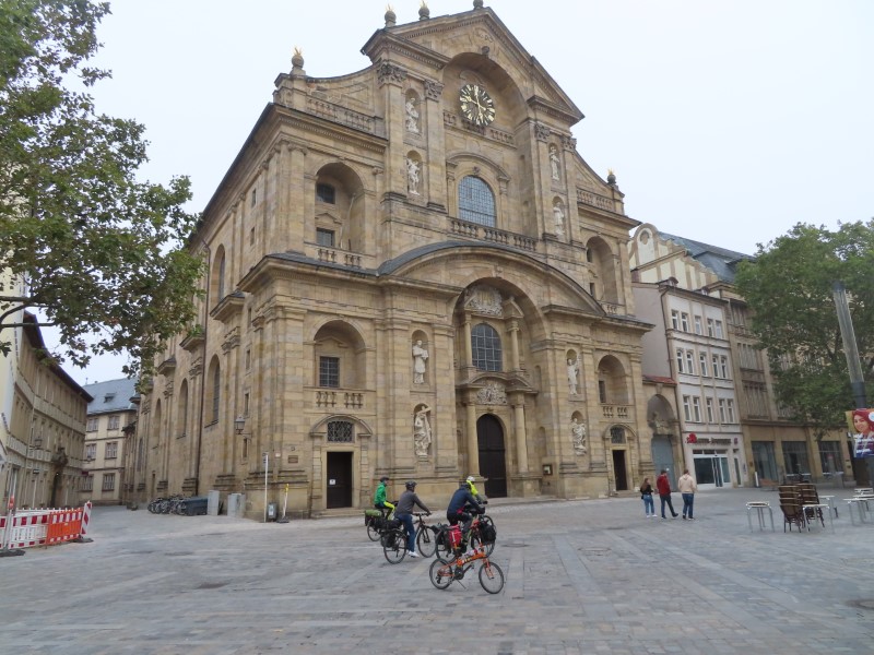 Ted's bike and other cyclists in front of St. Martin Catholic Church in Bamberg, Germany.