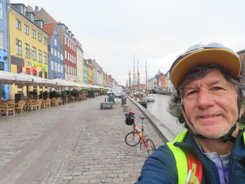 Ted with his bike near Stromma Canal Tour dock (Nyhavn street) in Copenhagen, Denmark. 