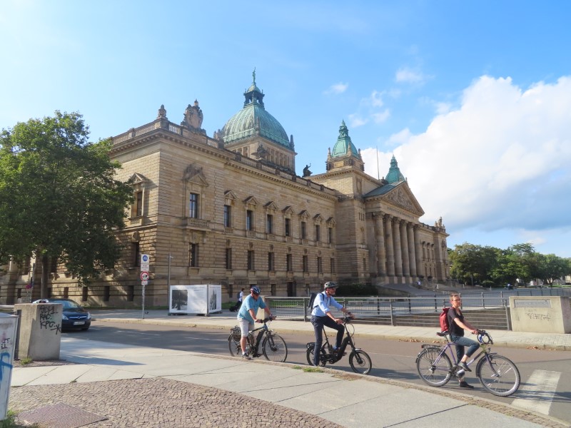 Cyclists in front of the Supreme Administrative Court in Leipzig, Germany.